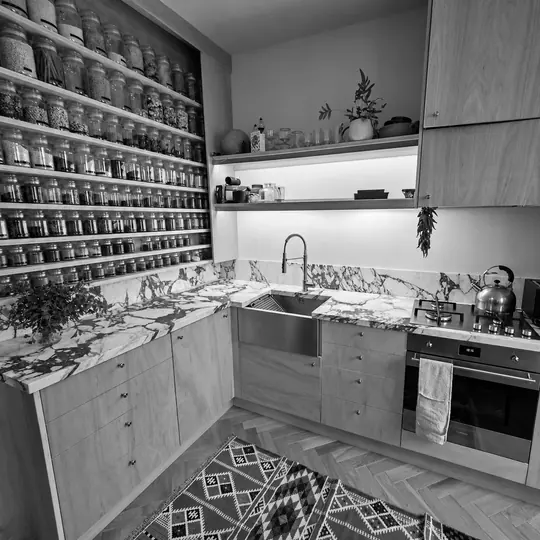 Monochrome bespoke kitchen cabinetry and marble detail